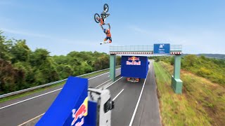 World First! Motorbike Flip Between Two Moving Trucks
