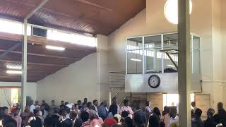 How Lutherans are to handle altar candles at end of service, demonstrated by Dep Bishop