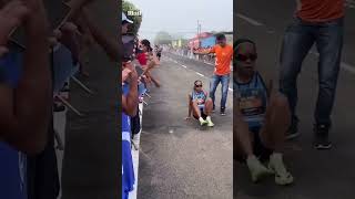 Determined runner crawls over the finish line