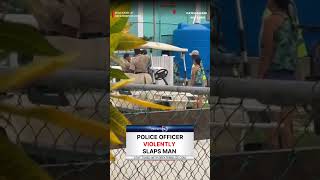 Police officer violently slaps man
