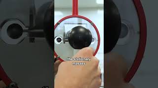 Watch gravity bring these two balls together in real time