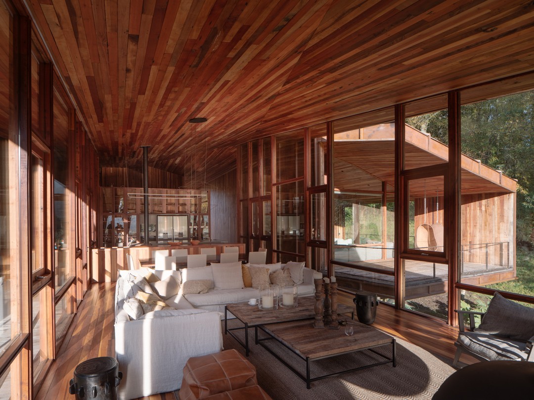 Casa Llu is envisioned as a family lodge inspired by the southern Chilean rain and the humble tents once used by local lumberjacks —a shelter designed to welcome four generations and their friends.

Beneath a vast roof that both protects and gathers, its spatiality embraces the “ga-loft” concept introduced by Cazú Zegers —a fusion between the American loft and the Chilean rural barn— creating a fluid, continuous interior free of corridors.

At its heart, a large central area brings together kitchen, dining, and living spaces into one, open to the view and framed by the house’s geometry.

Casa Llu is architecture as a collective home for living, contemplating, and taking refuge.
___

Casa Llu se concibe como un lodge familiar inspirado en la lluvia del sur de Chile y en las carpas precarias de los antiguos leñadores, un refugio pensado para acoger a cuatro generaciones y a sus amigos.

Bajo una gran cubierta que protege y reúne, su espacialidad adopta el concepto de “ga-loft” introducido por Cazú Zegers —una fusión entre el loft americano y el galpón rural chileno— que da lugar a un interior fluido, continuo y sin pasillos.

En su gran área central convergen cocina, comedor y estar, conformando un único espacio abierto a la vista y contenido por la geometría de la casa.

Casa Llu es arquitectura como hogar colectivo para convivir, contemplar y refugiarse.

Video realizado por @_clara_films
Cover Photo by Marcos Zegers
©Cazú Zegers Architecture - all rights reserved

#arquitectura #architecture #contemporaryarchitecture #modernarchitecture #cazuzegers #chileanarchitecture