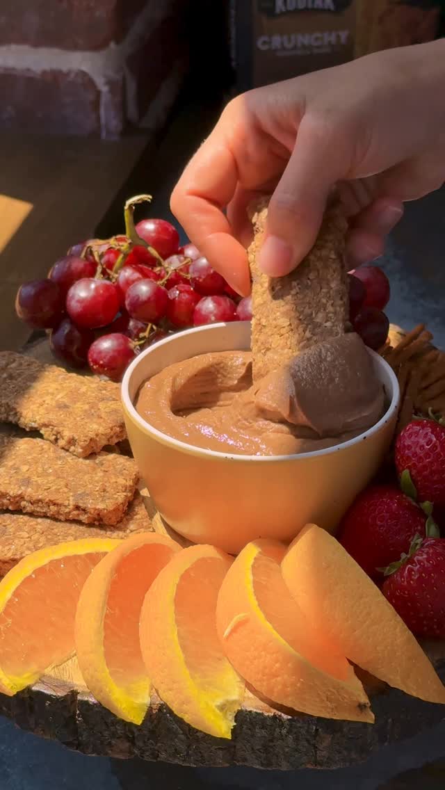 Have your (cheese)cake and eat it too — with a crunchy bar as a spoon.
This Chocolate Peanut Butter Cheesecake Dip is a wildly delicious blend of smooth cream cheese, irresistible chocolate, and rich peanut butter that creates a flavor combo that pairs best with a Kodiak® Crunchy Granola Bar.
Why get a utensil dirty when you’ve got a crunchy, protein-packed sidekick? 🤔
Ingredients:
• 8 oz. cream cheese, softened
• 1/2 cup peanut butter
• 1/2 cup heavy cream
• 1/2 cup powdered sugar
• 1 teaspoon vanilla extract
• 1/2 cup chocolate chips
• Kodiak Chocolate Chip Crunchy Granola Bars, fresh fruit, and pretzels for dipping
Directions:
1. Use an electric mixer or high-powered blender to mix cream cheese, peanut butter, heavy cream, powdered sugar, and vanilla extract until smooth.
2. Melt chocolate chips in the microwave at 50% power or in a double boiler over the stove.
3. Add the melted chocolate to the cream cheese mixture. Fold in until the color is even.
4. Transfer the dip to a serving dish.
5. Serve with Kodiak Crunchy Granola Bars, pretzels, and fresh fruit!
#backtoschool #snackhack #snackboard